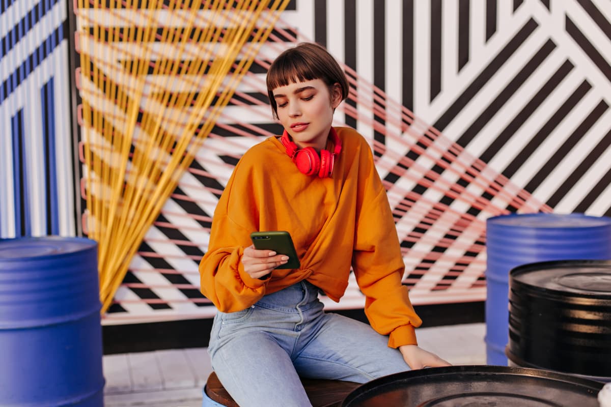 Stylish person in an orange sweater